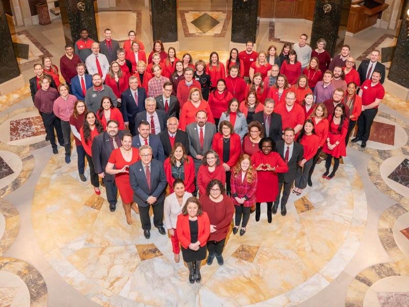 Advocates from the AHA join Wisconsin Lt. Gov. Sara Rodriguez (front), legislators and others at the State Capitol to kick off American Heart Month this year. The advocates were in Madison on Jan. 30 to talk with legislators about important policy priorities, including extending Medicaid postpartum coverage, nutrition incentive programs and youth tobacco use. (Photo courtesy of Wisconsin State Senate)